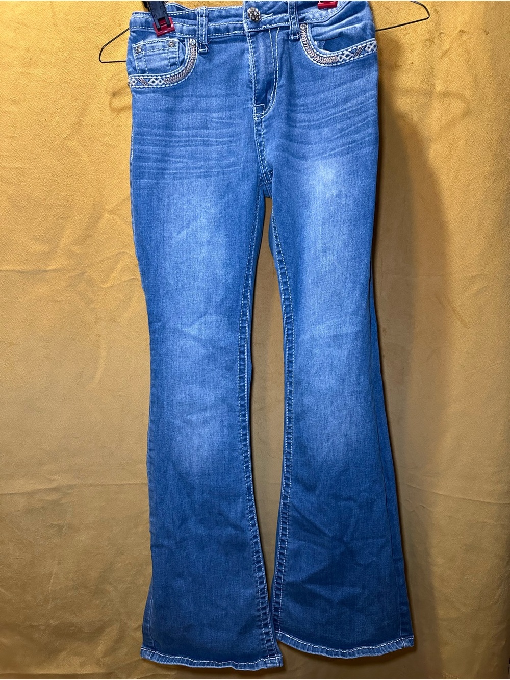 Classic Blue Denim Flare Jeans with Embellished Pockets